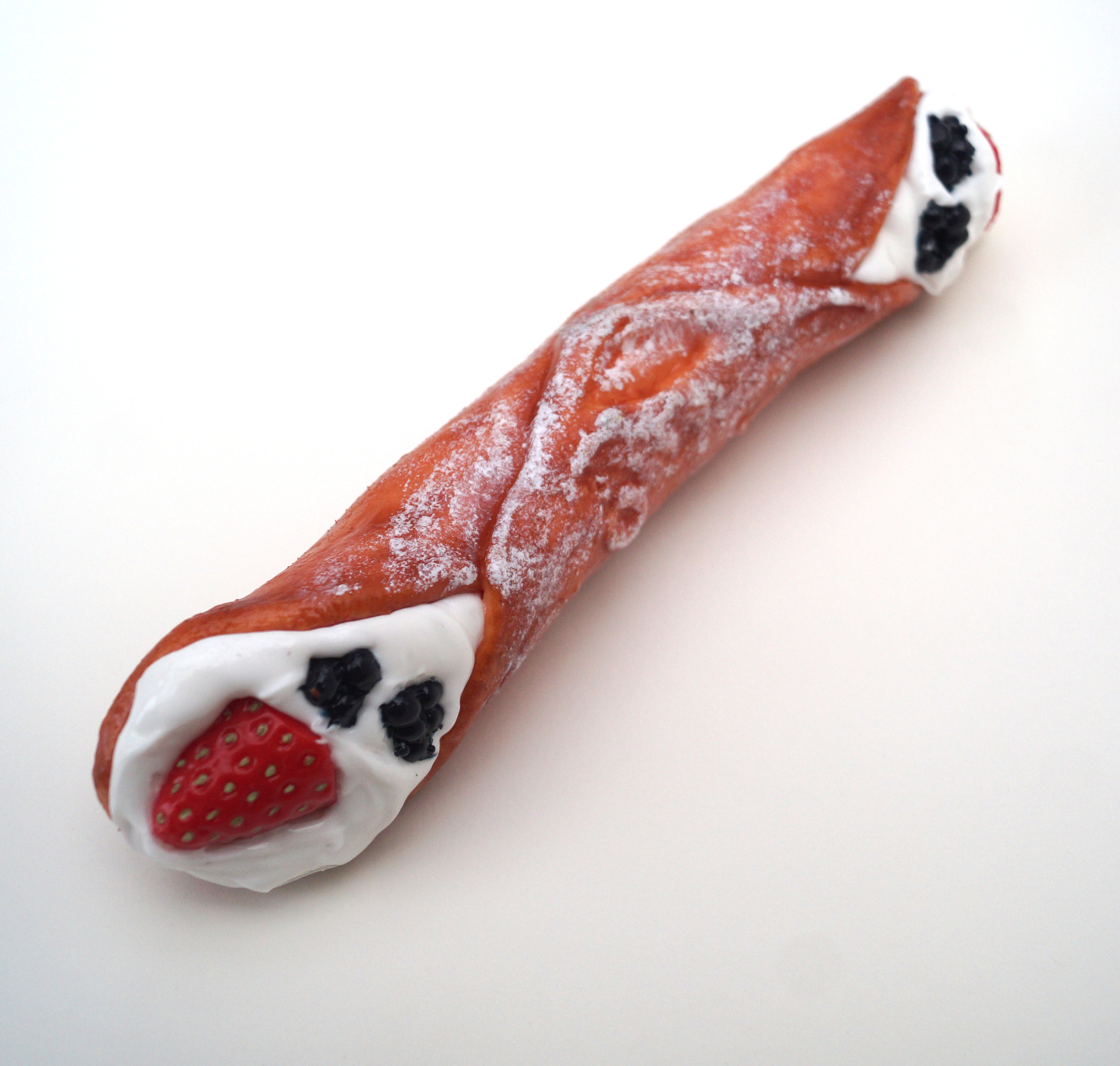 Premium Cannolo with sugar and fruits - the Sicilian variation of our love treats photo