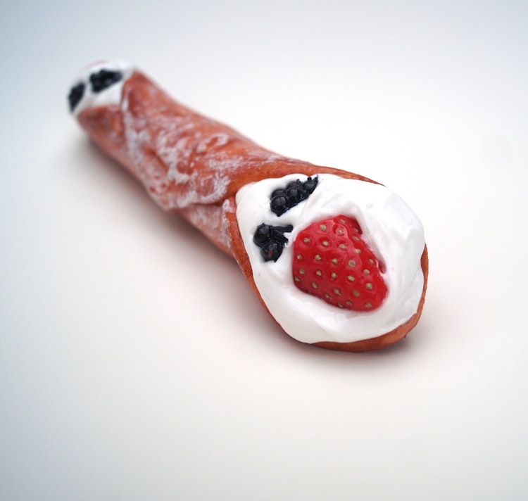 Premium Cannolo with sugar and fruits - the Sicilian variation of our love treats photo